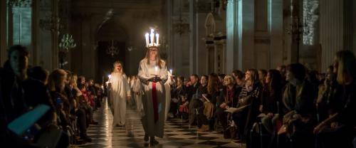 A candlelit procession for the Sankta Lucia service.