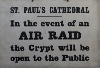 Second World War era sign relating to the use of the Cathedral Crypt as a public air raid shelter